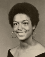 Classic black-and-white portrait of a Co-Chair Cheri Bryant Hamilton with a natural afro hairstyle.