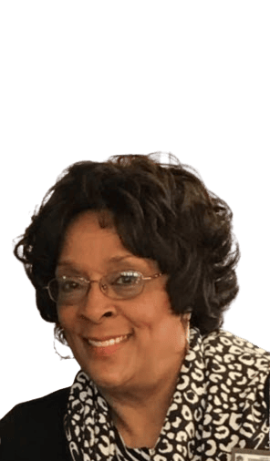 Close-up professional portrait of Cheri Bryant Hamilton smiling warmly, wearing a light-colored blouse and a necklace.